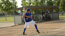 This image shows a batter during adult softball league.