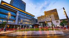 This image shows Broadway Square during a summer evening.