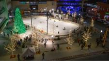 This image shows an aerial view of the Christmas Tree Lighting at Broadway Square.