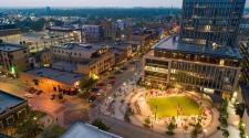 This image shows an aerial view of Broadway Square on a summer night.