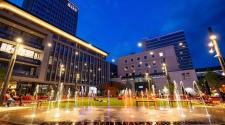 This image shows Broadway Square and RDO Tower all lit up during one summer night.