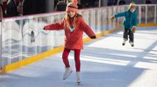 This image shows a photo of people skating on SCHEELS Skating Rink.