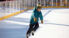 This image shows a photo of people skating on SCHEELS Skating Rink.