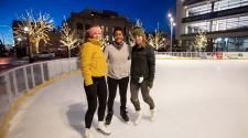 This image shows a photo of people skating on SCHEELS Skating Rink.