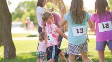 Kids playing in with bubbles while waiting for next event in Kids Triathlon