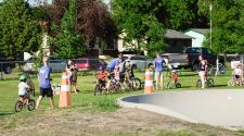 Many kids on bikes lined up at Madison Bike Park for kids triathlon bike event