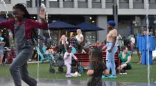 Photo of Kids in the Spouts at Broadway Square night bazaar