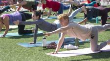 photo of people doing yoga at broadway square