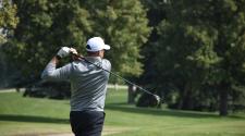 a man golfing on a golf course