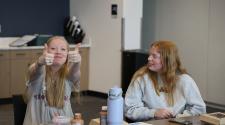 This image shows two girls at a FORGE internship meeting.